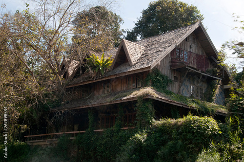 Kok river Thailand, derelict house being overgrown or reclaimed by forest © KarinD