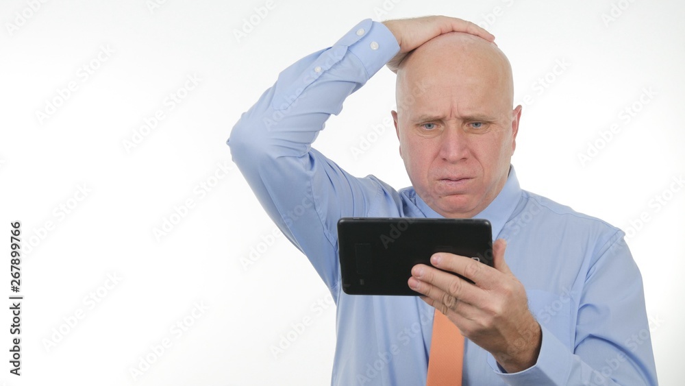 Businessperson Read Financial Bad News on Touch Tablet and Gesticulate Disappointed Businessperson Read Financial Bad News on Touch Tablet and Gesticulate Disappointed