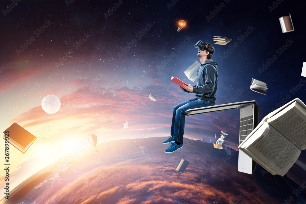 Virtual reality experience, young man in VR glasses. Mixed media