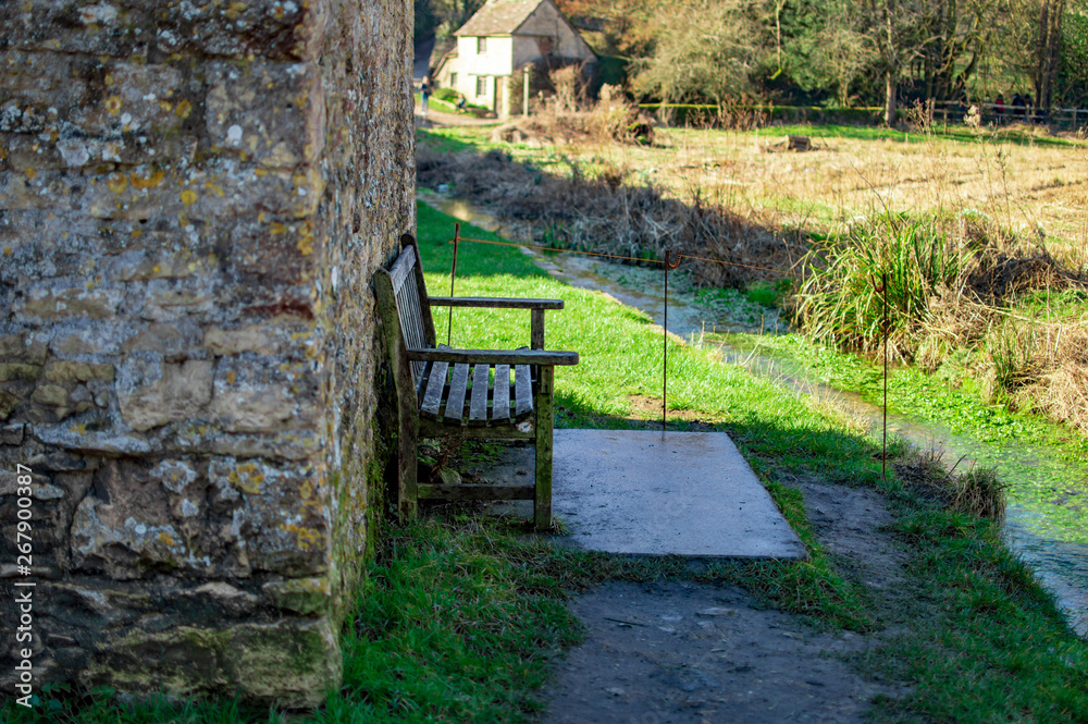 Bibury village in cotswolds and a home having a chair outside Bibury village in cotswolds and a home having a chair outside