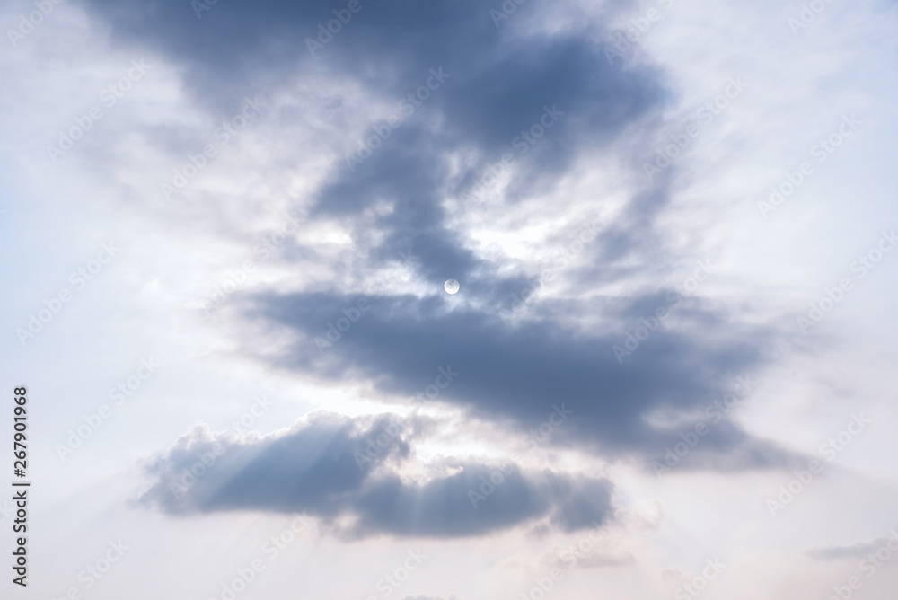 The sun blocking the clouds in the sky The sun blocking the clouds in the sky