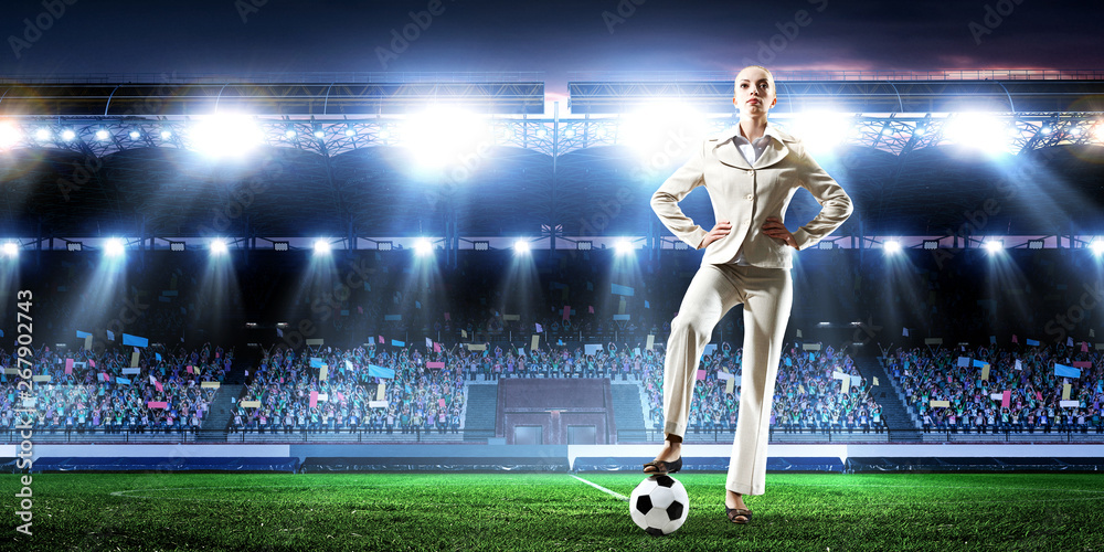 Fototapeta premium Business lady on football stadium. Mixed media