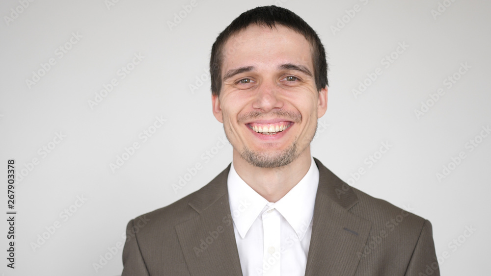 portrait of young attractive successful happy businessman on a white background portrait of young attractive successful happy businessman on a white background