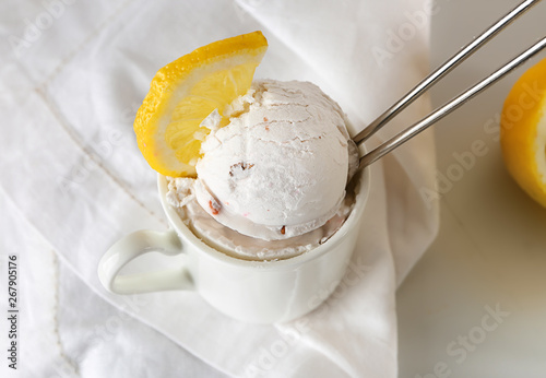 Cup with tasty ice cream on table  closeup