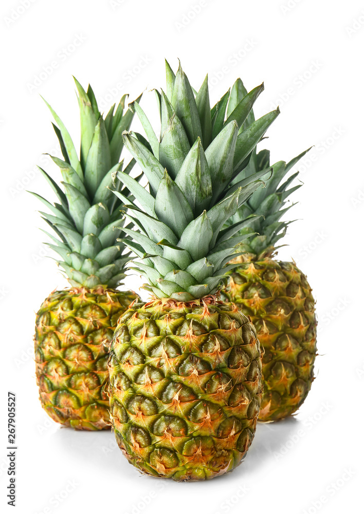 Ripe pineapples on white background Ripe pineapples on white background