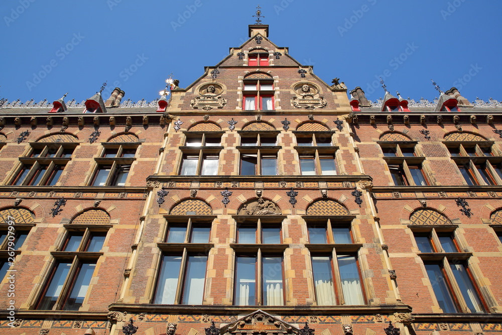 Wide angle on the external facade of the old Ministry of Justice (built between 1876 and 1883), located on Plein Square, with details of the carvings, The Hague, Netherlands