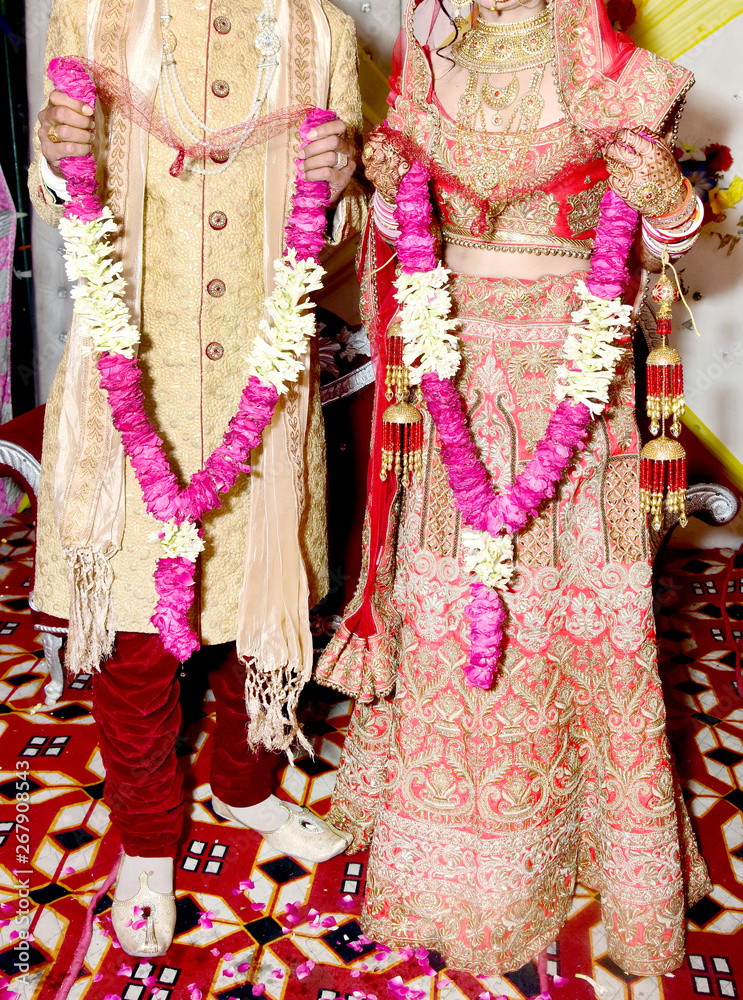 Jai Mala Xxx Video - The bride and groom at the Indian wedding garlands or Jaimala ceremony  Stock Photo | Adobe Stock