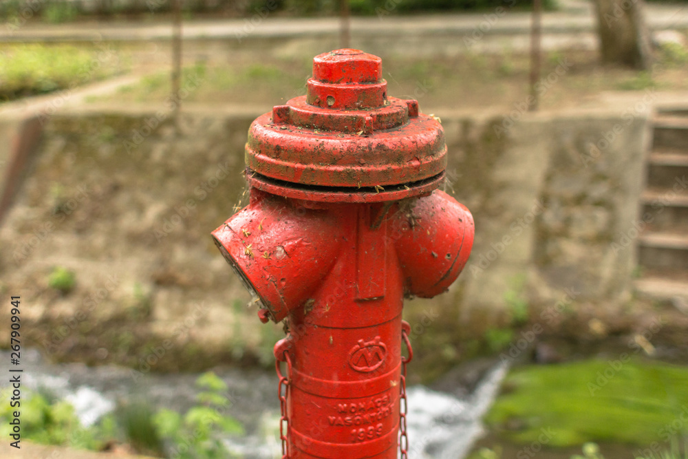 Old red hydrant. Fire extinguishing agent. Fire Service. The profession of firefighter. Emergency due to careless handling of fire. Fire Prevention. Risk of fire. Fire street system. Old red hydrant. Fire extinguishing agent. Fire Service. The profession of firefighter. Emergency due to careless handling of fire. Fire Prevention. Risk of fire. Fire street system.