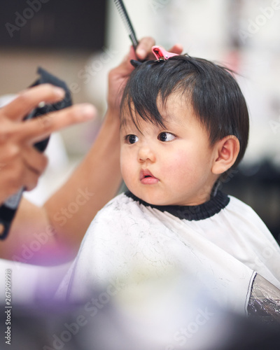 asian baby boy haircutting.