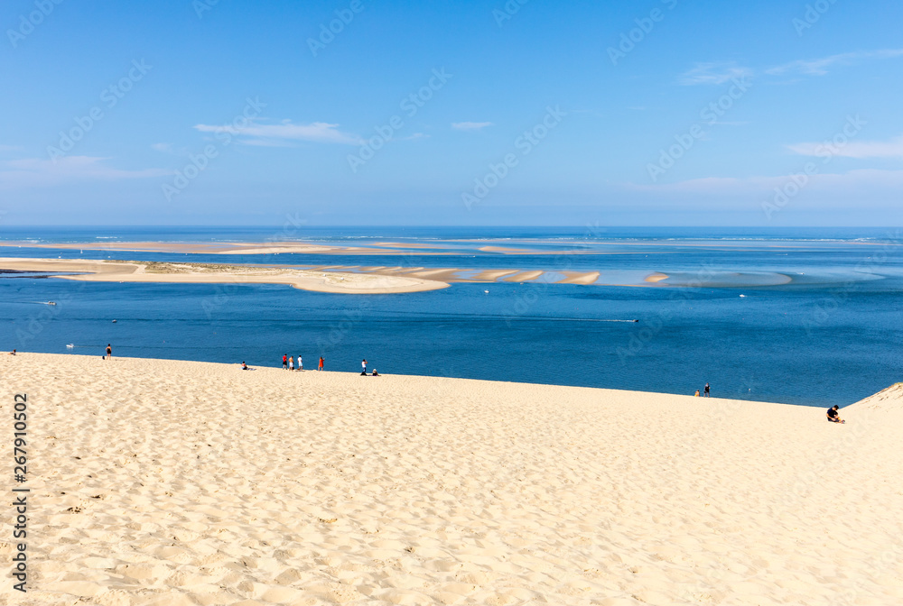 People on the Dune of Pilat, the tallest sand dune in Europe. La Teste-de-Buch, Arcachon Bay, Aquitaine, France People on the Dune of Pilat, the tallest sand dune in Europe. La Teste-de-Buch, Arcachon Bay, Aquitaine, France