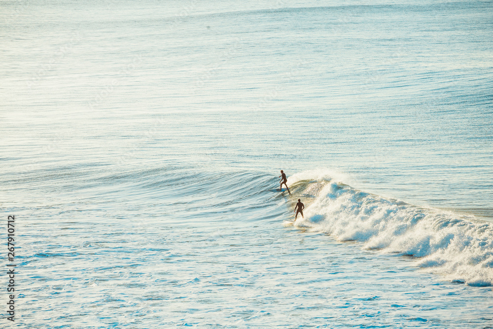 Fototapeta premium Surfers and Waves at Bells Beach, Australia