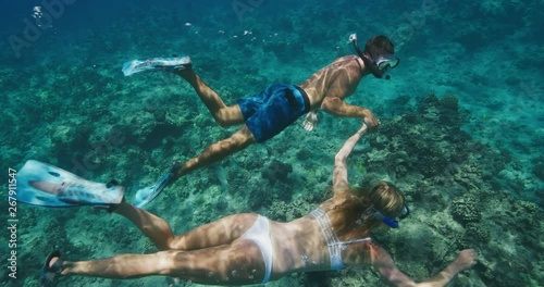 Attractive couple snorkeling together on tropical vacation, summer holidays in paradise