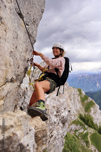 Young woman in the "Friedberger" via ferrata in Tirol, Austria