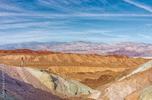 Hiker in front of beautiful landscape in Death Valley National Park. USA
