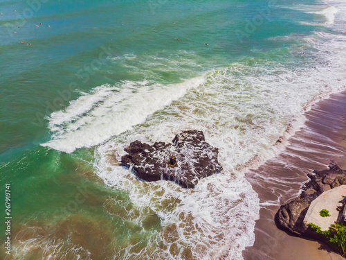 Rock on Batu Balong beach, the world famous surf hot spot on Bali photo