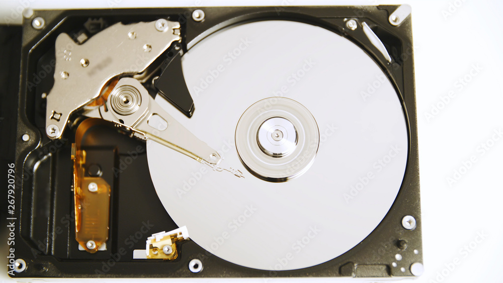 Top view opened hard drive spinning plate Top view opened hard drive spinning plate