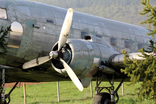 Canvas Print Left rotary engine of Douglas Dakota DC-3 WWII plane placed in field at exhibit