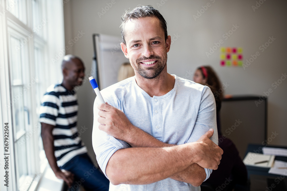 Designer smiling after giving a presentation to office colleague Designer smiling after giving a presentation to office colleague