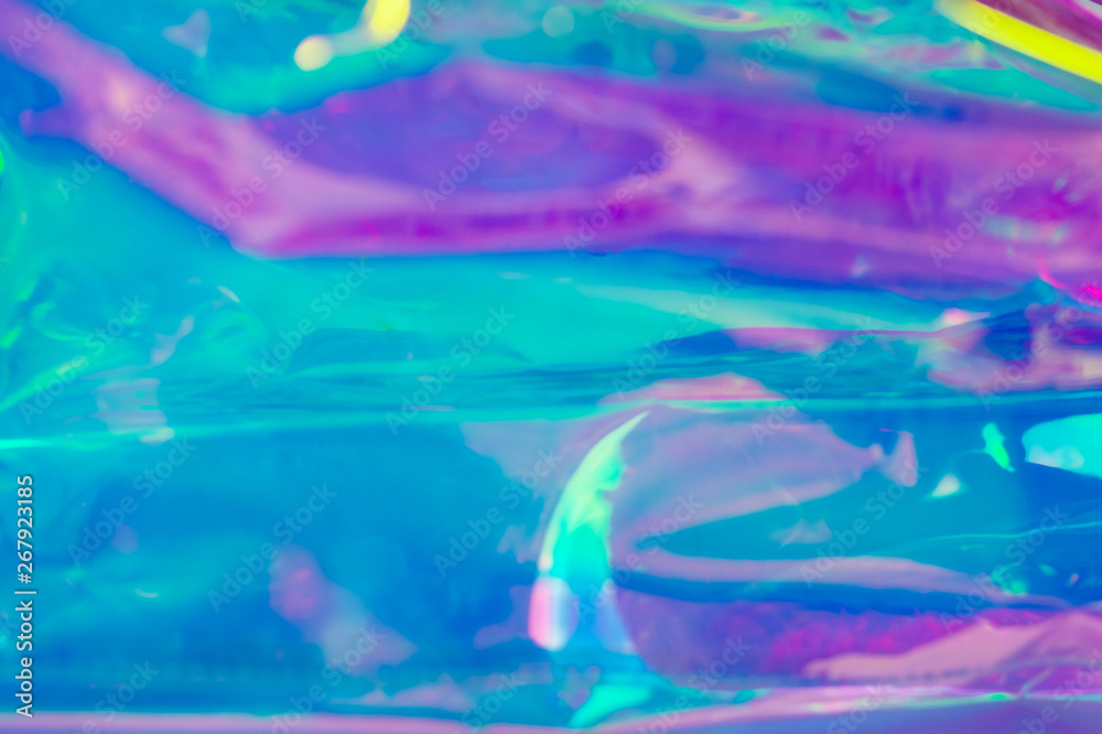 Blurry abstract iridescent holographic foil background