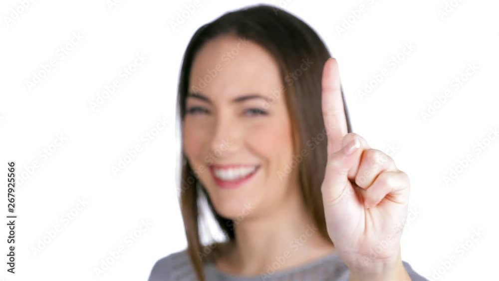 Happy woman gesturing one with the finger isolated on white background Happy woman gesturing one with the finger isolated on white background