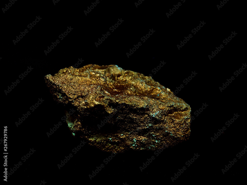 macro Gold ore in the boulder , precious stone on black background macro Gold ore in the boulder , precious stone on black background