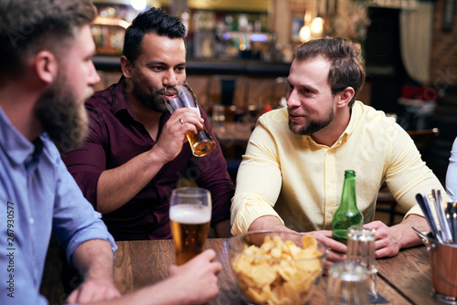 Three men spending time together in the pub