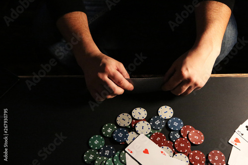Man is playing poker. Gamble gaming. Free time hobby. Hands over the table.