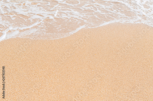 Wave of the sea on the sandy beach