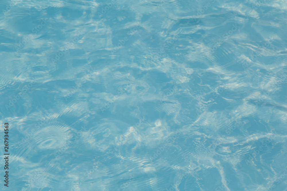 Blue pool water with sun reflections Blue pool water with sun reflections