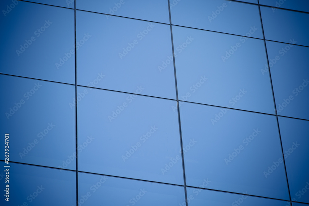 Modern office building with blue glass windows Modern office building with blue glass windows