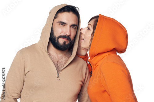 Woman whispering a secret to the man