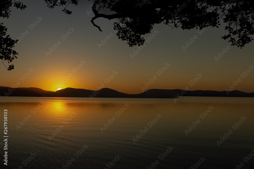 beautiful sunset over Watson Taylors Lake in Crowdy Bay National Park, New South Wales, Australia