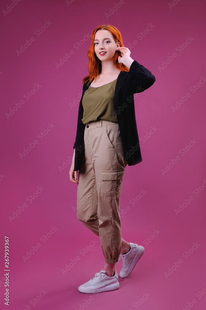 Fashion studio portrait of young woman on pink background Fashion studio portrait of young woman on pink background