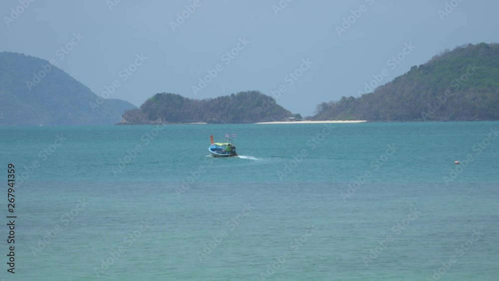 traditional Thai longtail boat sailing in the sea traditional Thai longtail boat sailing in the sea
