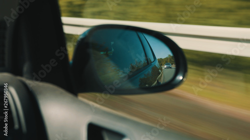 Following Spy Car in Back Mirror © jakobsmeyer