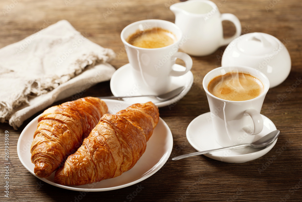 breakfast with cups of coffee and croissants breakfast with cups of coffee and croissants