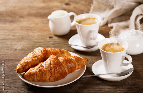 breakfast with cups of coffee and croissants