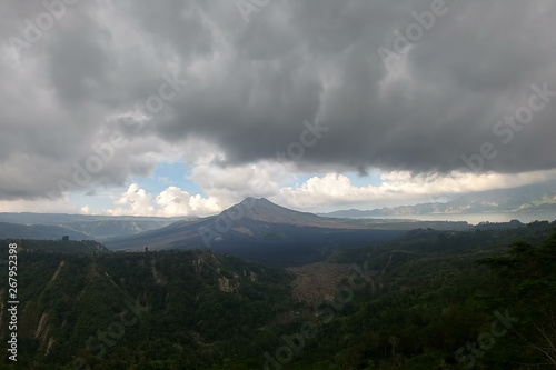 Heavy clouds and scorched plain near Batur volcano on Bali island, Indonesia,