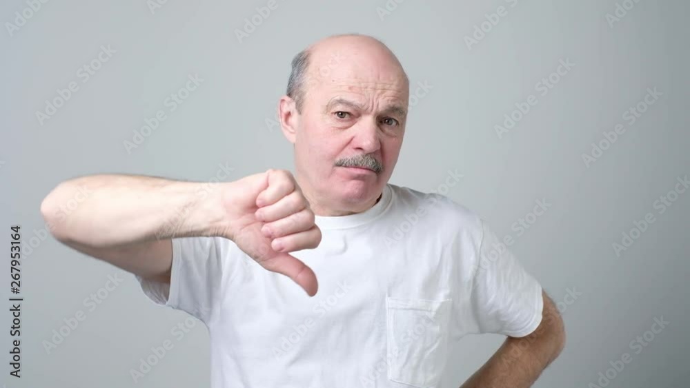 Mature man showing different gestures Mature man showing different gestures