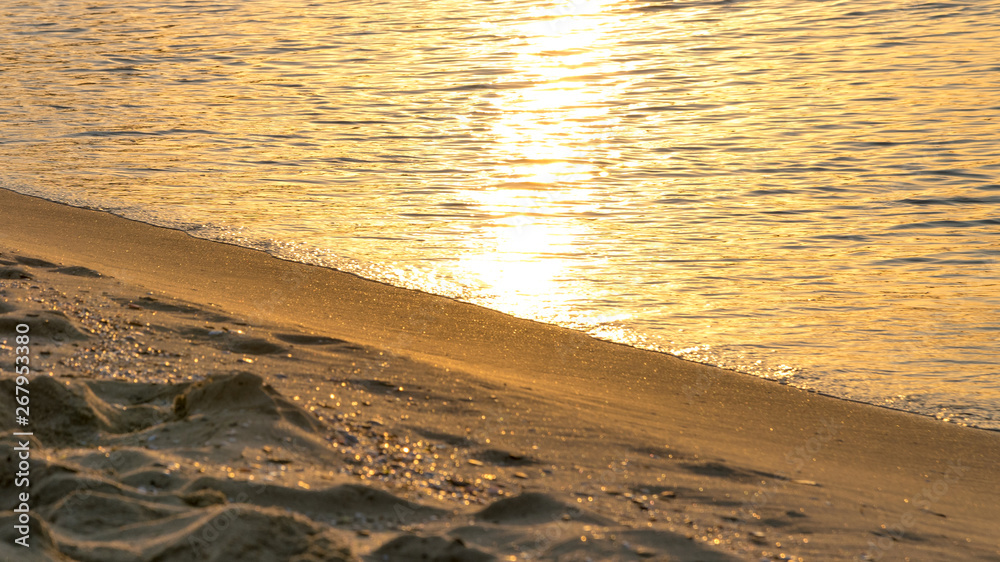Sand and waves at sunrise in Sunny Beach on the Black Sea coast of Bulgaria
