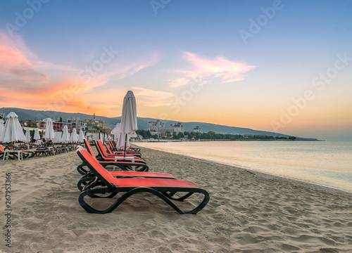 Obraz na płótnie Chairs and umbrellas on a beautiful beach at sunrise in Sunny Beach on the Black Sea coast of Bulgaria w salonie