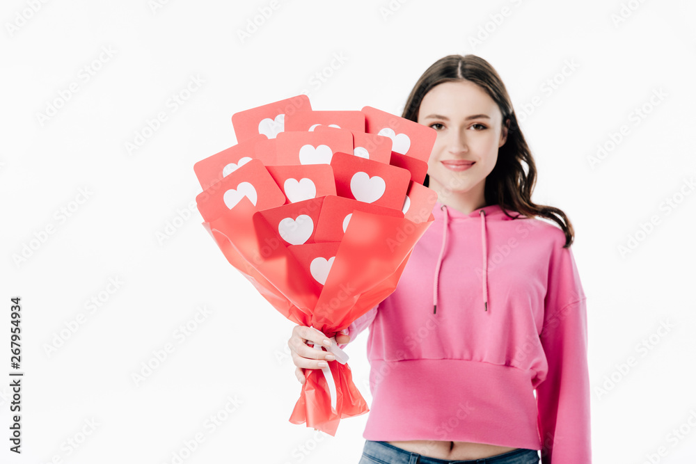 pretty smiling girl holding bouquet of red paper cut cards with hear symbols isolated on white pretty smiling girl holding bouquet of red paper cut cards with hear symbols isolated on white