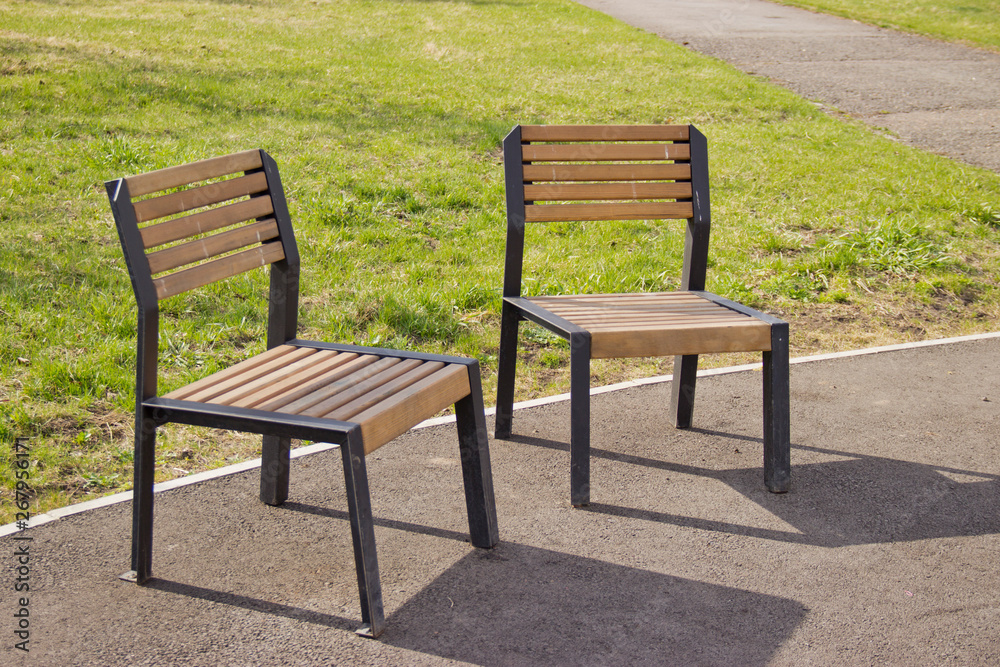 chair on the street for rest, bench for one