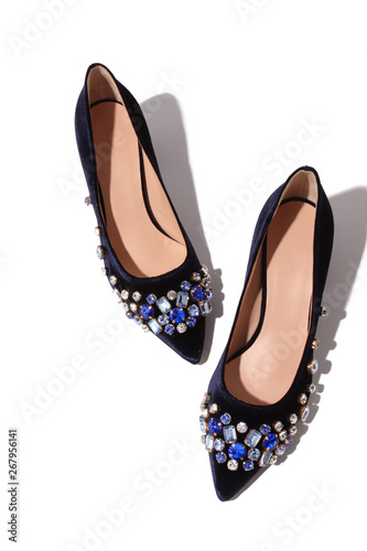 Crystal embellished high heeled suede shoes over white background 