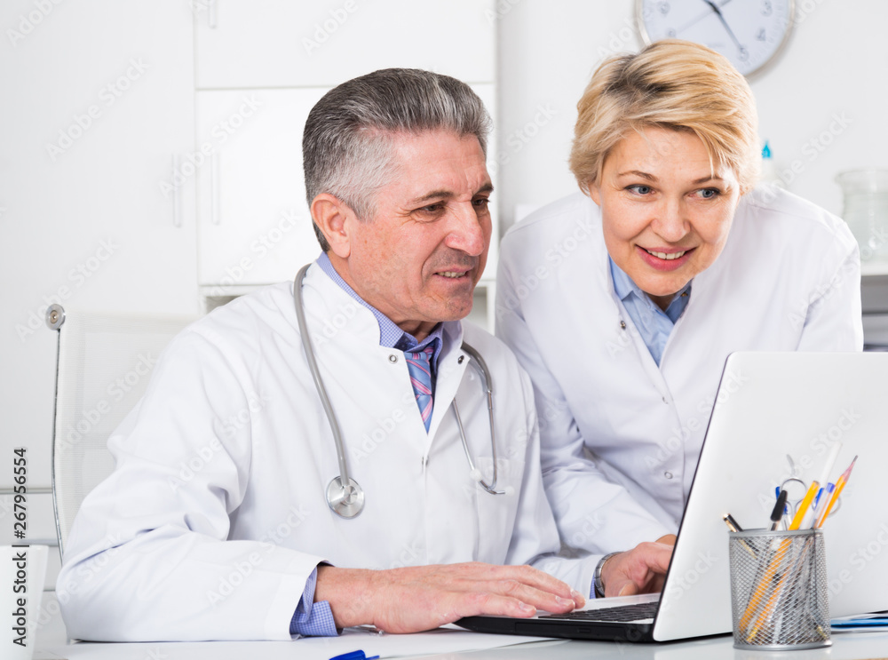 Fototapeta premium Doctor and nurse reading information