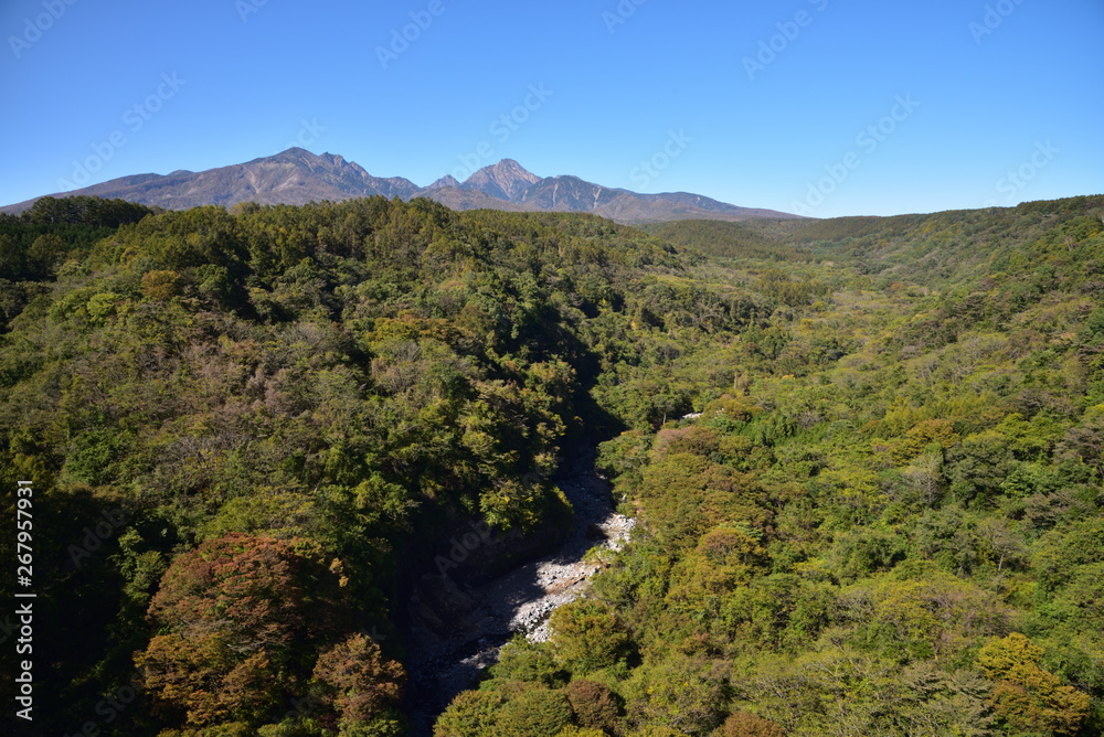 Mountains with red leaves and blue sky Mountains with red leaves and blue sky