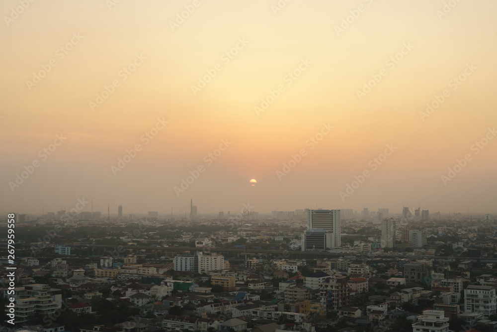 Sunset at Bangkok, capital of Thailand with dust and smoke