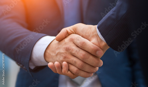 Two business people shaking hands, businessman, hand photo