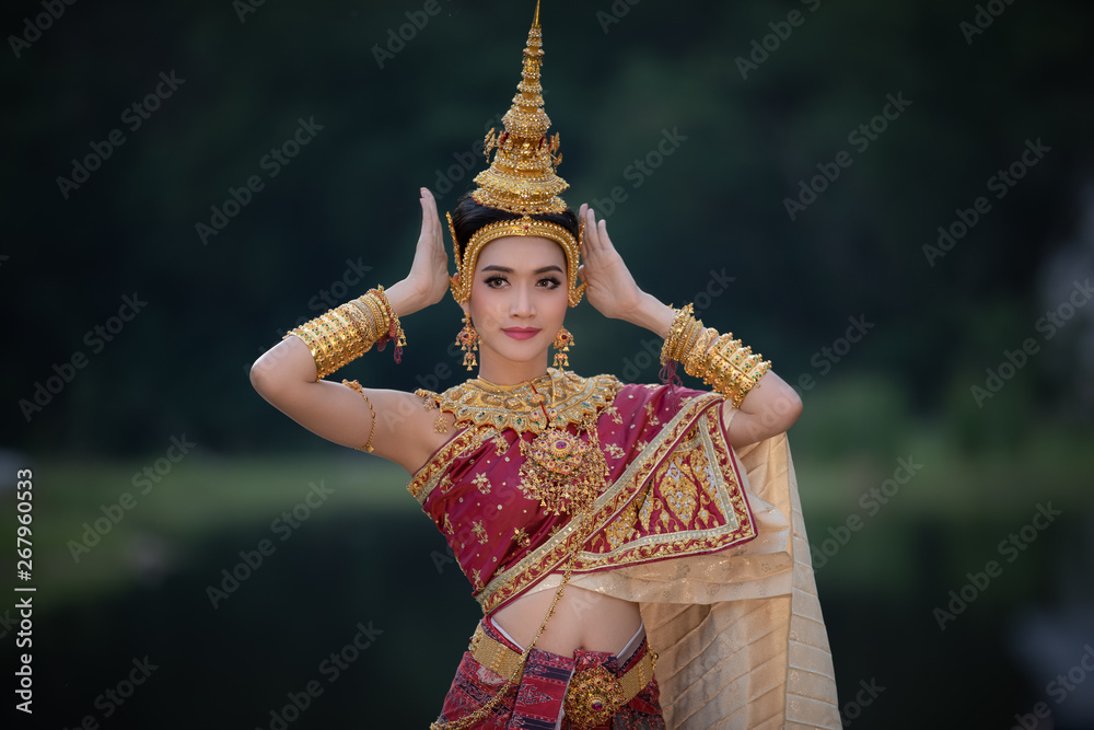 thai model in thai traditional dress red and jewellery in the garden thai  girl tradition concept Stock Photo | Adobe Stock