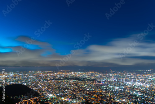 Night cityscape view of Sapporo city from Mountain Moiwa observation. The most popular tourist destinations viewpoint for tourism. Sapporo, Hokkaido, Japan. photo